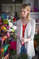 Female florist preparing a flower bouquet