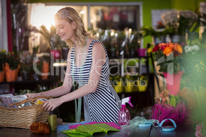 Female florist preparing flower bouquet