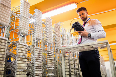 Technician using digital cable analyzer