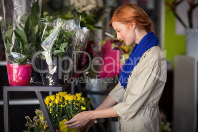 Female florist arranging flower bouquet