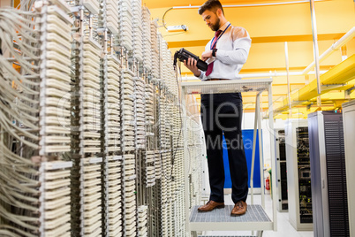 Technician using digital cable analyzer