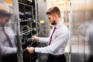 Technician examining server