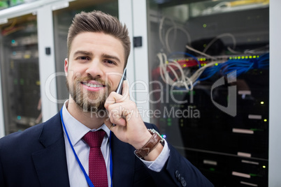 Technician talking on mobile phone