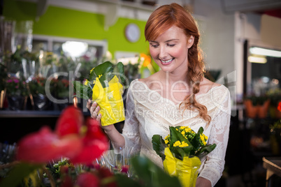 Female florist holding flower bouquet