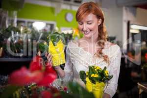 Female florist holding flower bouquet