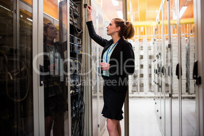 Technician examining server