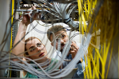 Technicians fixing cable