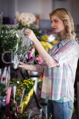 Female florist preparing a flower bouquet