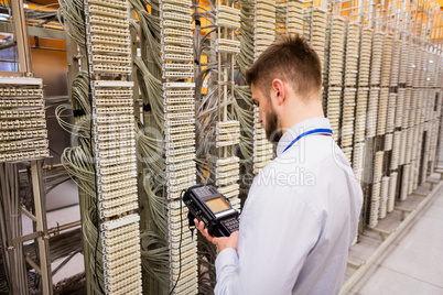 Technician using digital cable analyzer