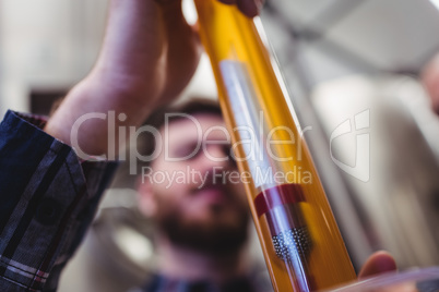 Manufacturer holding beer tube Manufacturer holding beer tube
