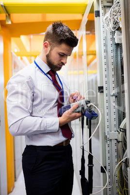 Technician using digital cable analyzer