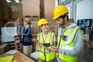 Warehouse workers and managers interacting with each other