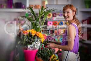 Female florist preparing flower bouquet