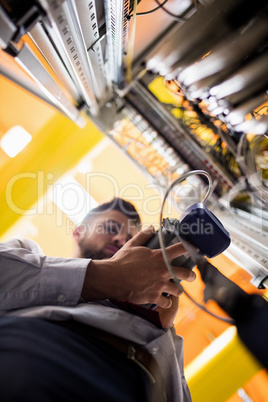 Technician using digital cable analyzer