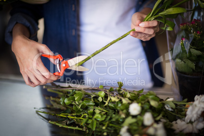 Female florist preparing flower bouquet