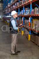 Warehouse worker checking the inventory
