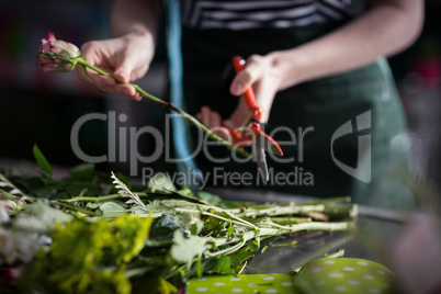 Female florist preparing flower bouquet