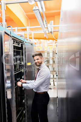 Technician examining server