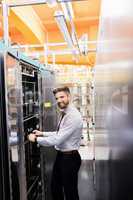 Technician examining server