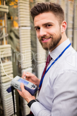 Technician using digital cable analyzer