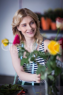 Female florist arranging flower