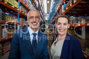 Portrait of warehouse manager and client smiling