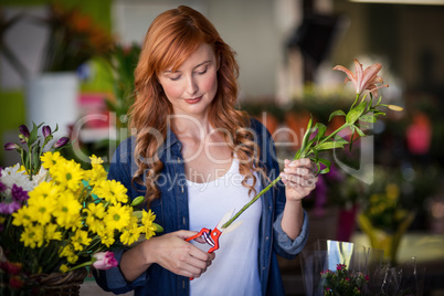 Female florist preparing flower bouquet