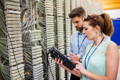 Technicians using digital cable analyzer