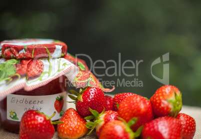 strawberry jam glass and berries homemade