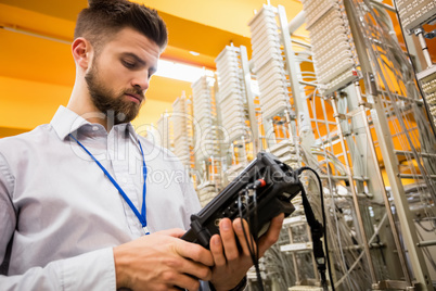 Technician using digital cable analyzer