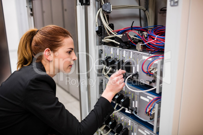 Technician examining server