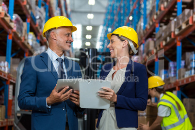 Warehouse manager and client interacting with each other