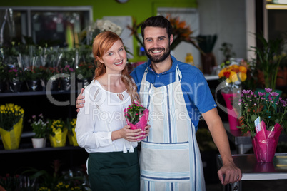 Couple standing with flower bouquet