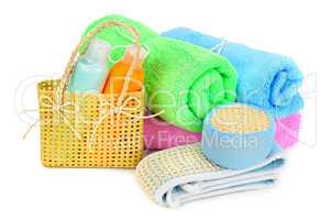 towels and shampoo isolated on white background