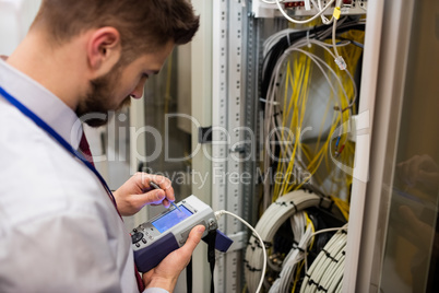 Technician using digital cable analyzer