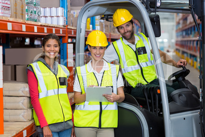 Male and female workers smiling together