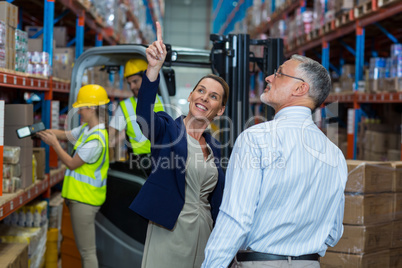 Warehouse manager and client interacting with each other