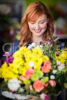Female florist standing and smiling
