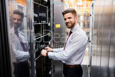 Technician examining server