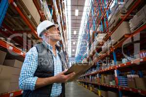 Warehouse worker looking at packages