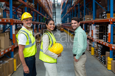 Portrait of warehouse team standing together