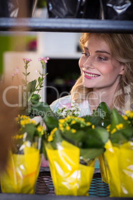 Female florist arranging flower bouquet