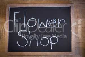 Close-up of slate with flower shop sign
