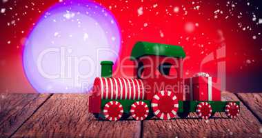 Composite image of train model with gift