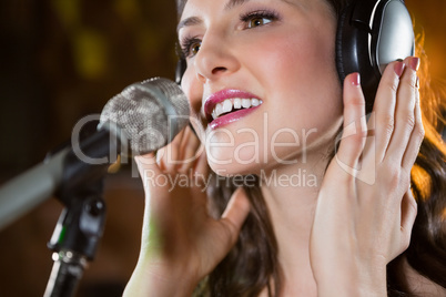 Woman singing in bar