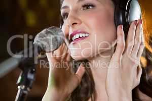 Woman singing in bar