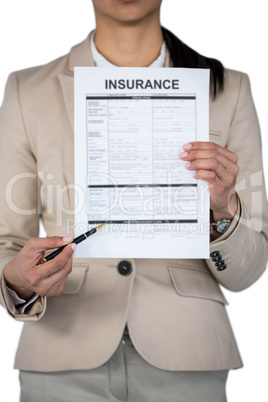 Mid section of businesswoman showing insurance contract