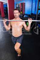 Male athlete lifting barbell