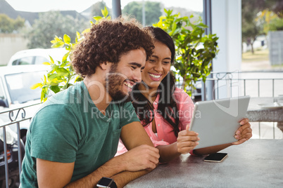 Couple looking at digital tablet