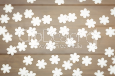 Snowflake christmas decoration scattered on wooden table
